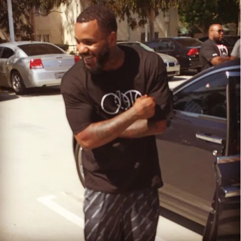 The Game wearing a BBJ three-ball logo tee, shot after a game at the Drew League